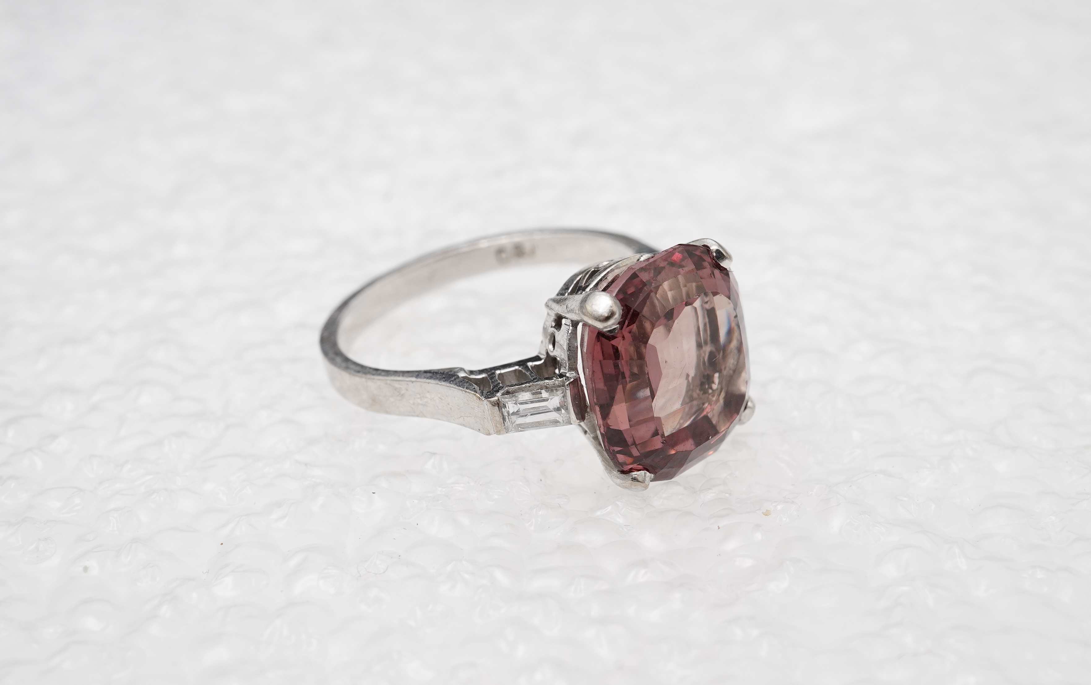 A garnet and diamond ring